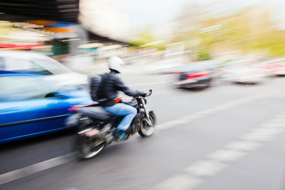 A person riding a motorcycle
AI-generated content may be incorrect.